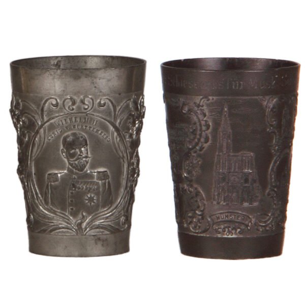 Pewter beakers (two), 4.3" ht., relief, military scenes.